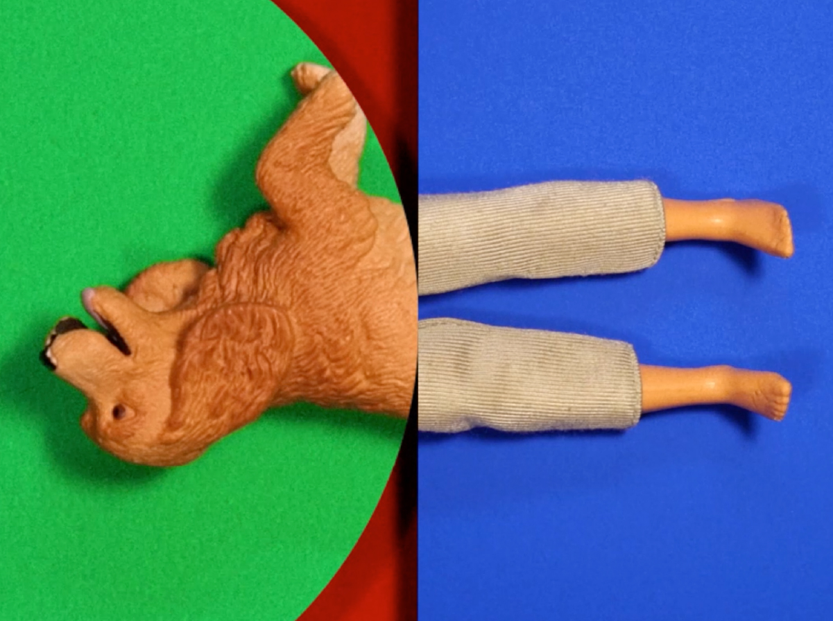 A split image of geometric shapes. On the left side, a light brown dog figurine appears upside down in a green circle shape. On the right side, the feet and legs of a toy doll in beige pants appears in a blue square shape. The two figures meet each other in the middle.