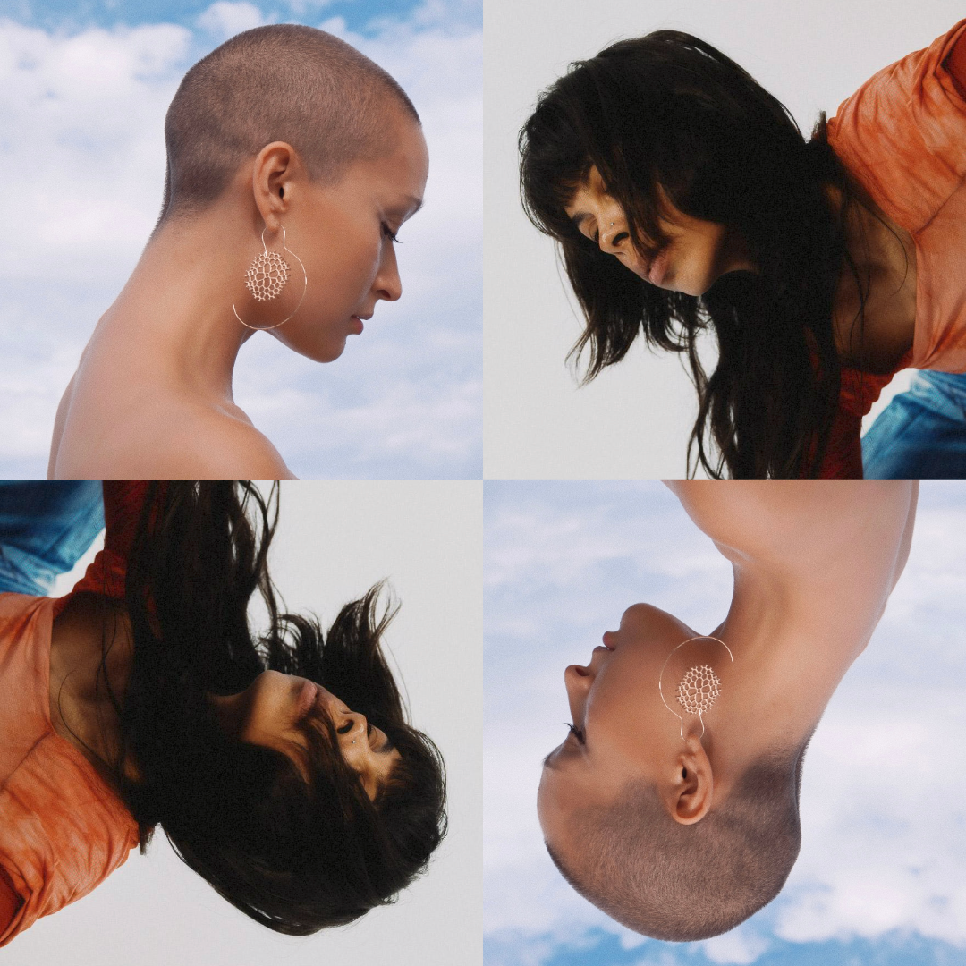 A four grid image of the two artists. Yarro, with short buzzed hair, bare shoulders and a large hooped earring with an ornate design, looks down in front of a background of clouds in a blue sky. Nyda, in an orange shirt with long black hair draping their face, leans forward in front of a light grey background. The two images are doubled below and upside down.